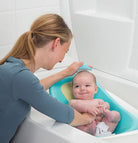 Nursery Care Health & Grooming Kit - mother bathing baby