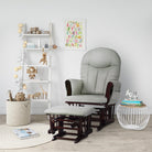 Nursery room with a rocking chair, shelves, and decorative items.