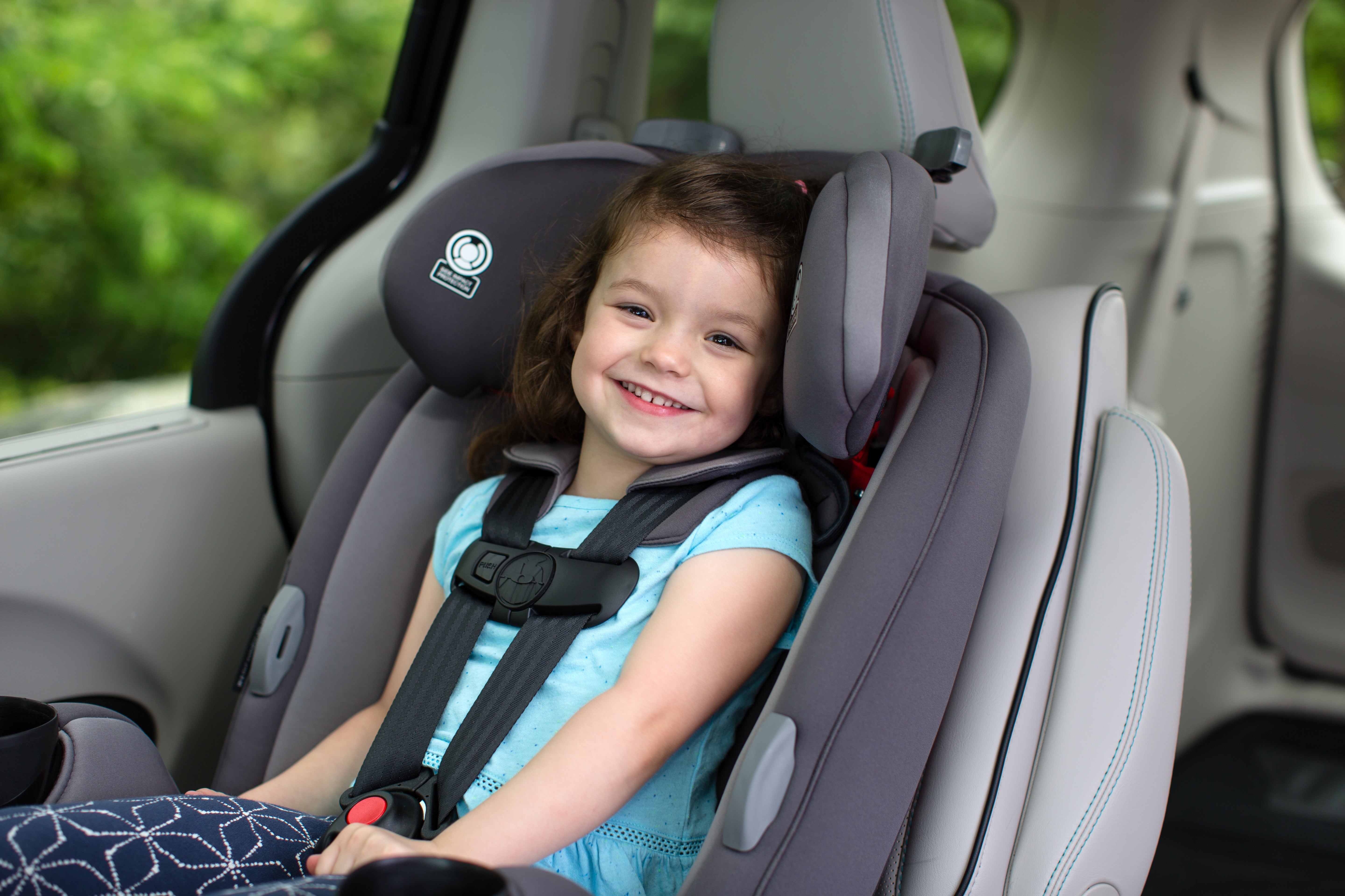 Girl smiling in Grow and Go Car Seat