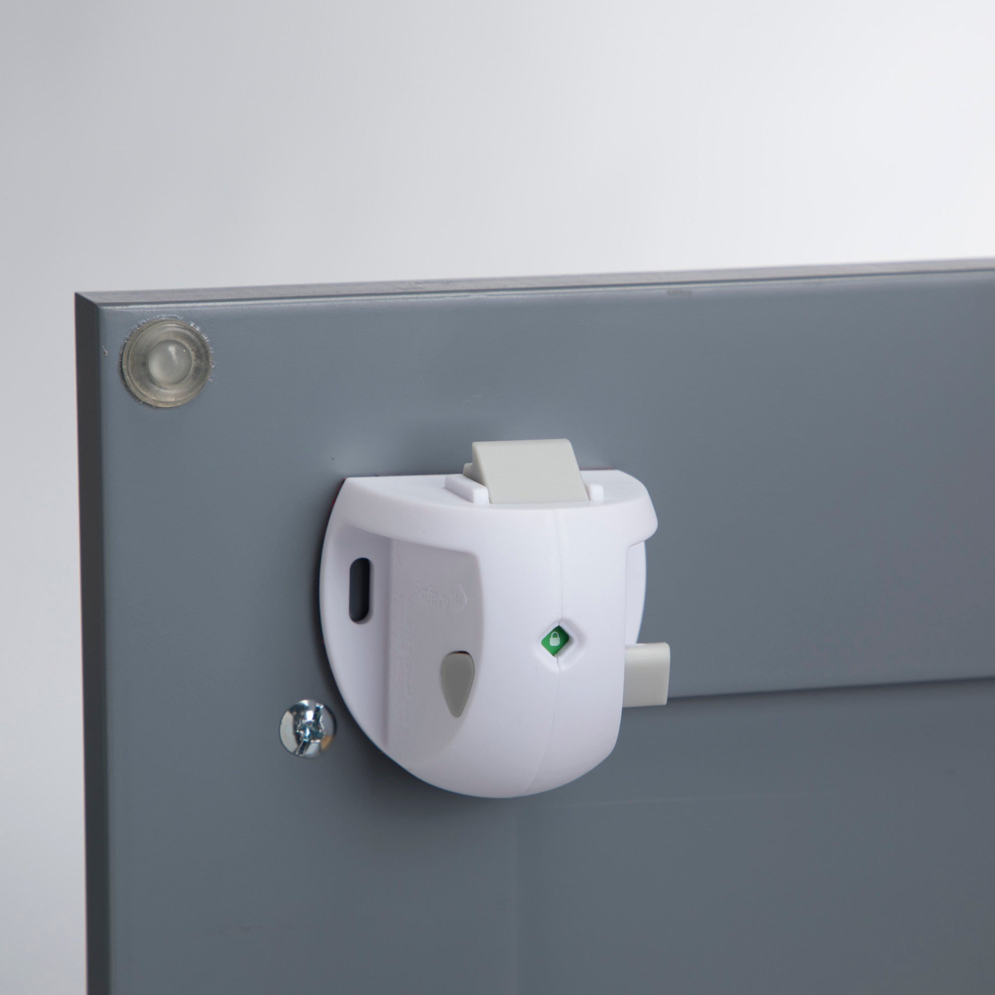 Lock shown on the inside of a cabinet door