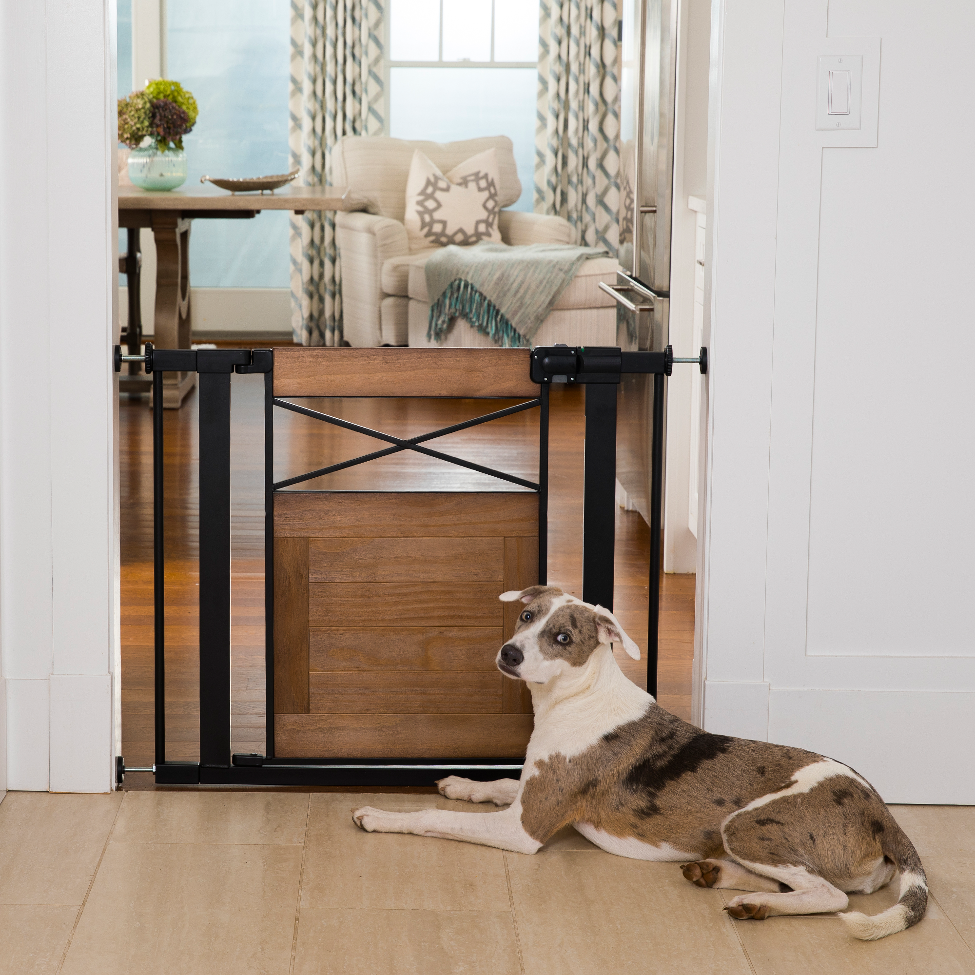 dog sitting by installed farmhouse style gate