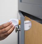 Key being turned on Adhesive Magnetic Lock System