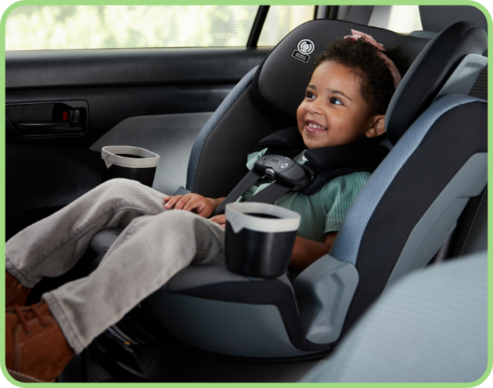 Child smiling in her car seat