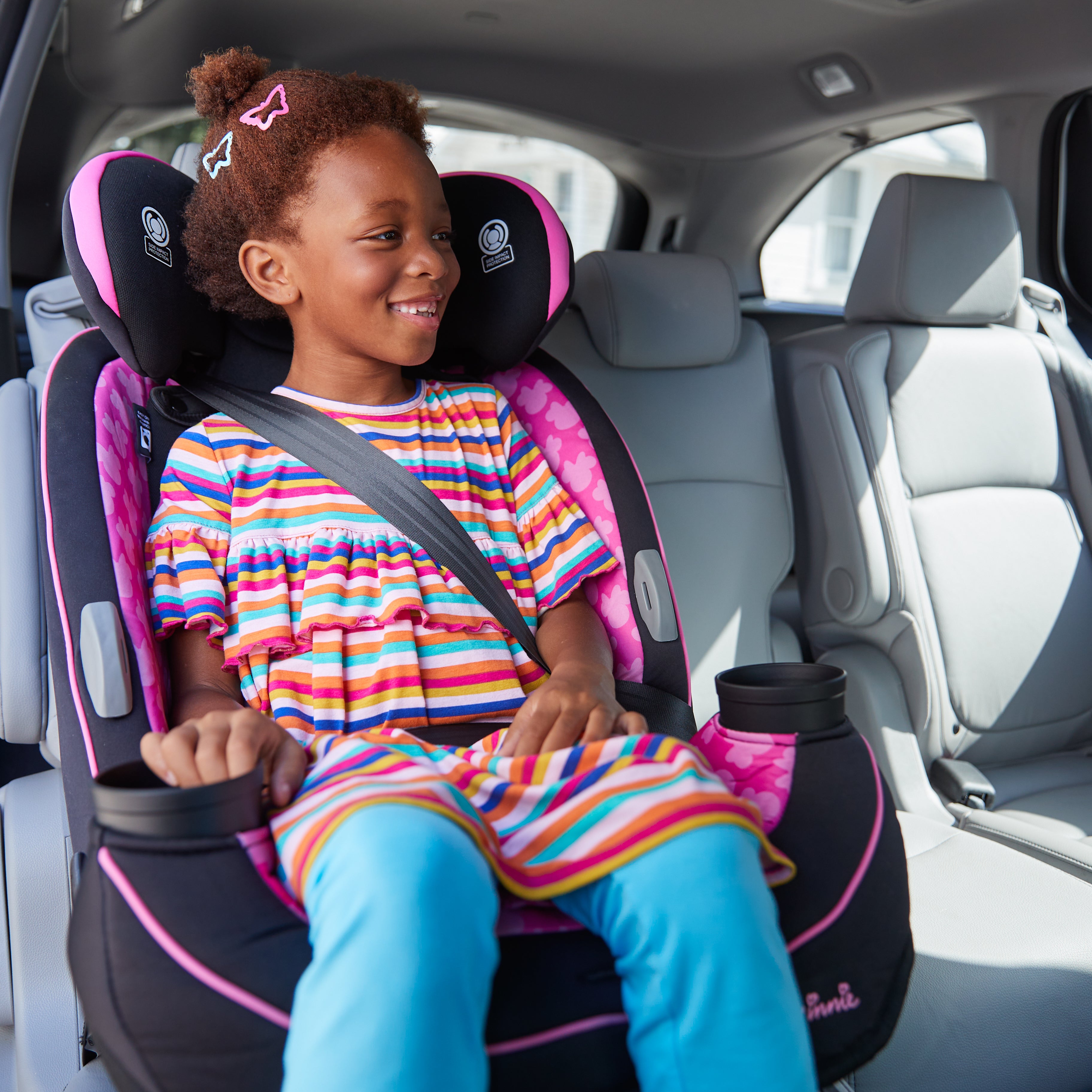 Disney Baby Grow and Go™ All-in-One Convertible Car Seat - girl smiling in forward-facing seat