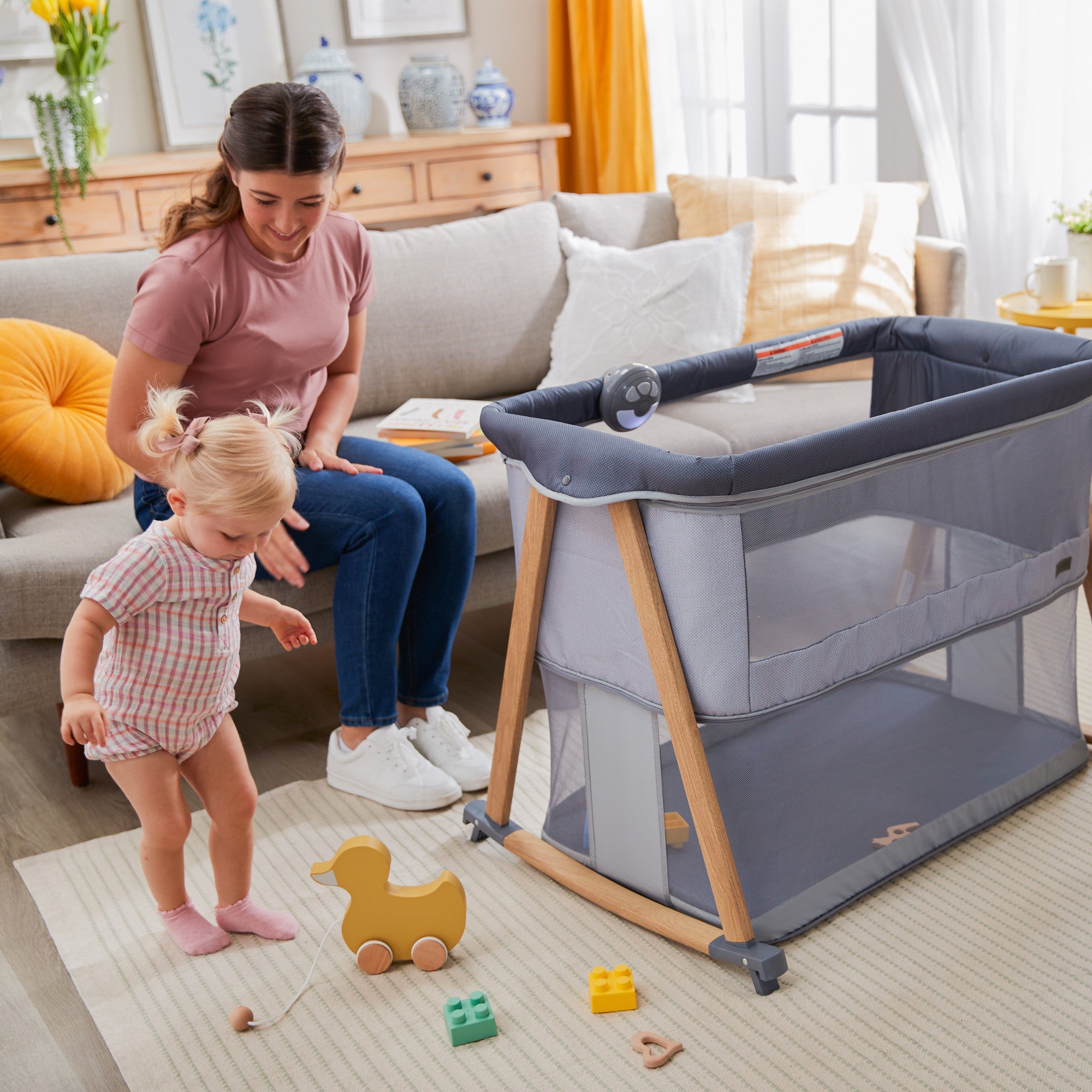 Rest-and-Romp Play Yard - toddler and mother playing next to play yard