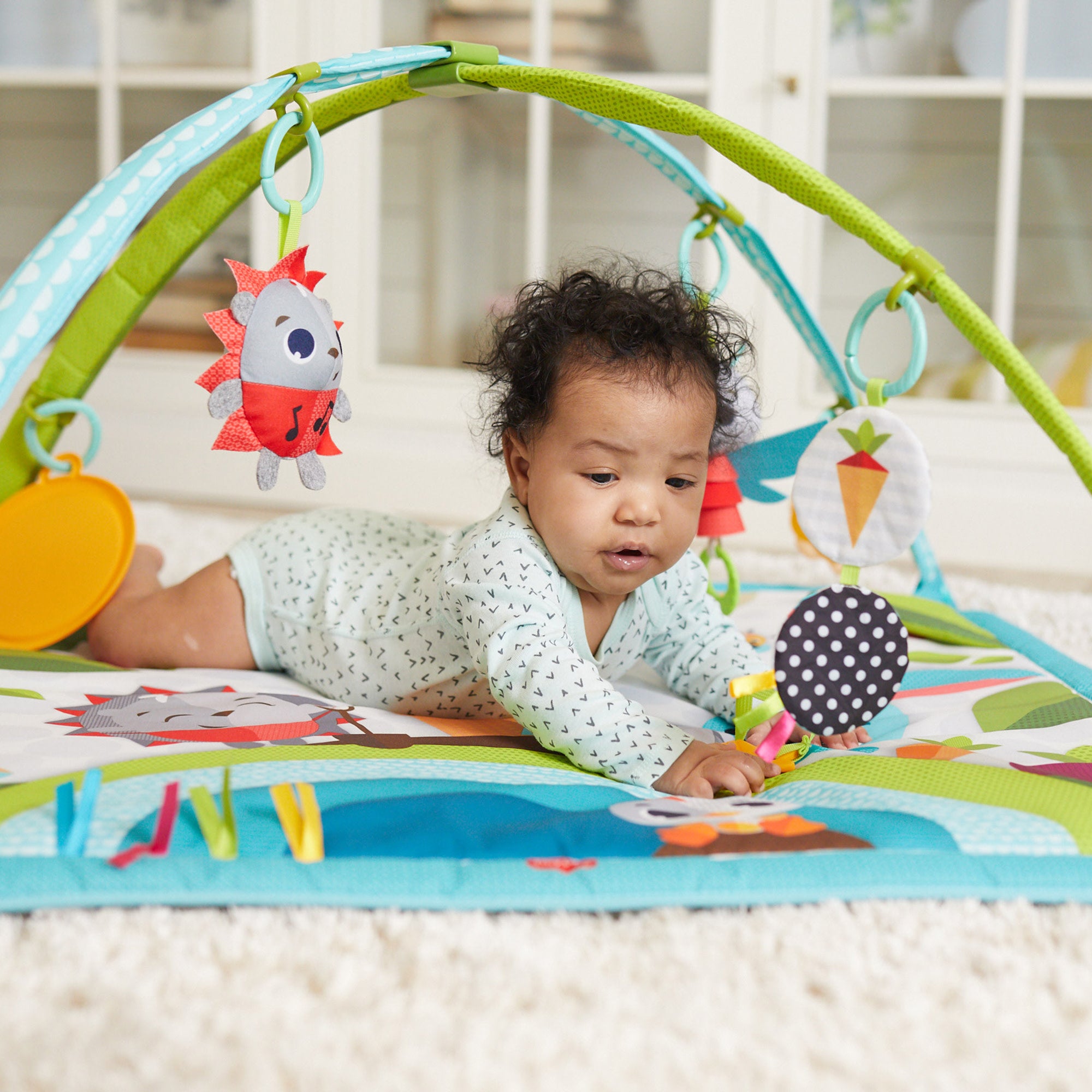 Tiny Love Meadow Days Sunny Day Gymini - baby engaging in tummy time on mat