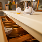 Secure-to-Explore Adhesive Magnetic Locks - showing lock in drawer and another lock and key on the counter